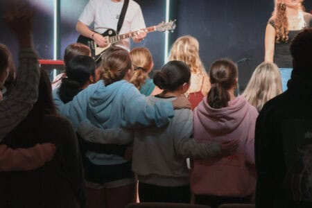 Youth group worship session at Canyon Springs Church with music and community.