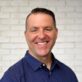 Headshot of Blake Miller, smiling man in blue polka dot shirt for Canyon Springs Church.