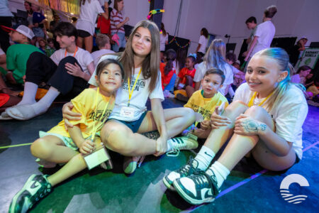 Group of children and teens enjoying activities at Canyon Springs Church event.