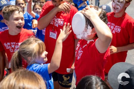Children enjoying a playful outdoor activity at Canyon Springs Church event.
