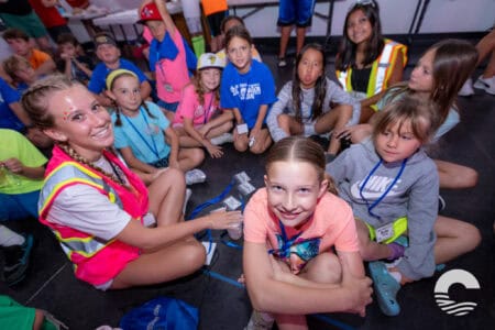 Group of children at Canyon Springs Church youth event, smiling and engaging in activities.