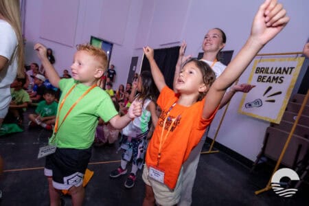 Children participating in worship at Canyon Springs Church event.