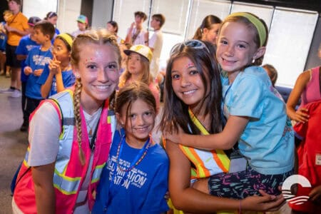 Happy children at Canyon Springs Church youth gathering, smiling and enjoying community activities.