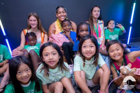 Group of diverse children and teens at Canyon Springs Church youth event.