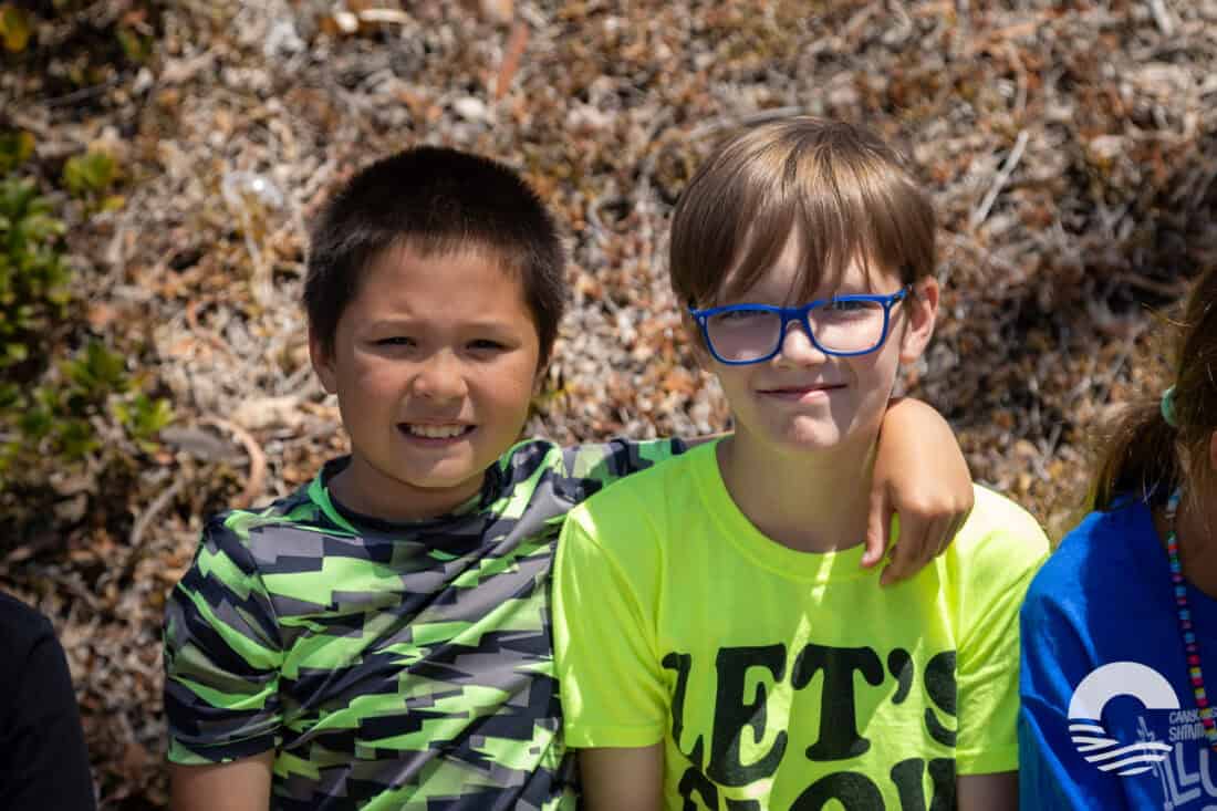Youth group members smiling outdoors at Canyon Springs Church event.