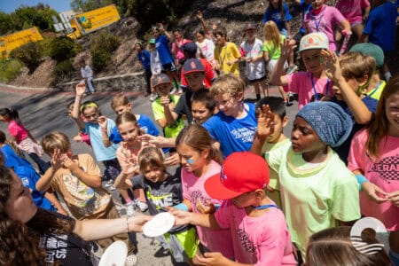 Children participating in outdoor activity at Canyon Springs Church event.