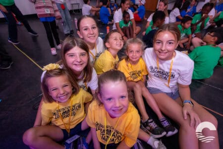 Group of smiling children at Canyon Springs Church youth event.