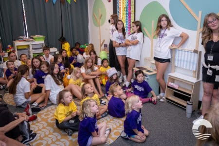Children attending a kids' event at Canyon Springs Church, engaging in activities and listening to a.