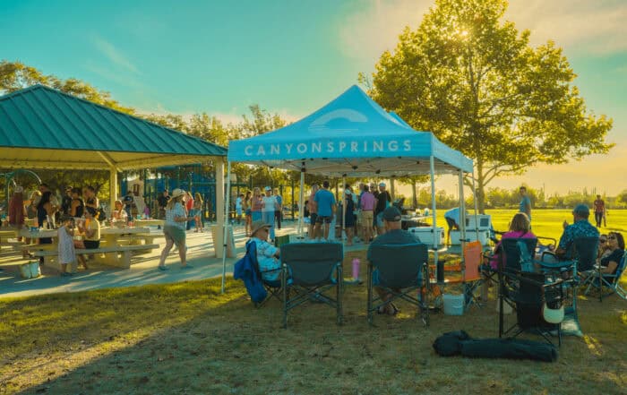 Canyon Springs Church outdoor picnic with people enjoying sunny day.