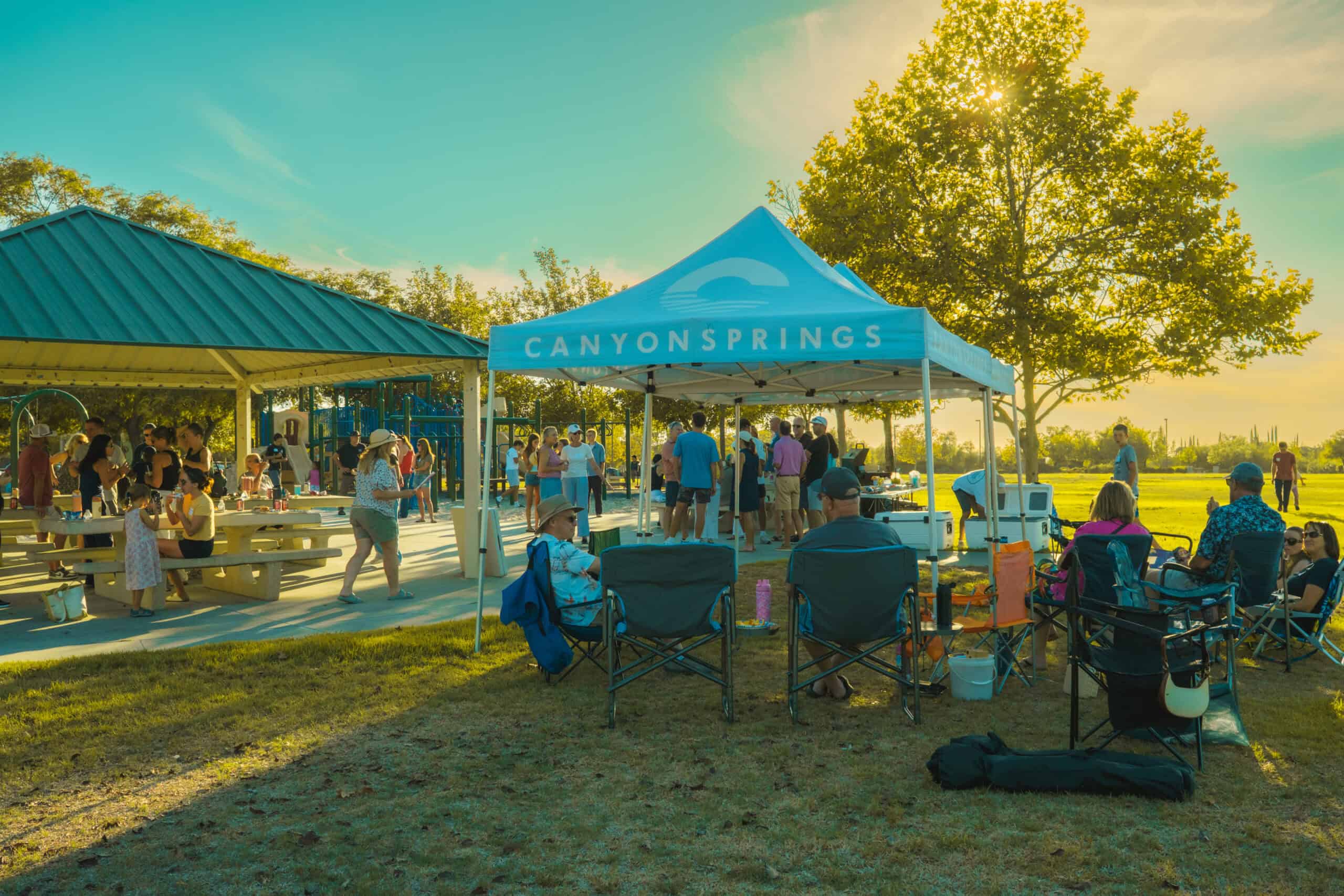 Canyon Springs Church outdoor picnic with people enjoying sunny day.