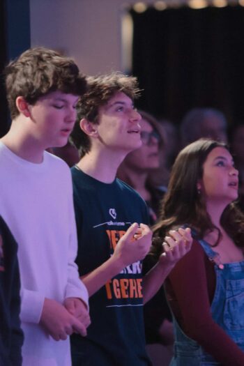 Group of teenagers attending a youth service at Canyon Springs Church.