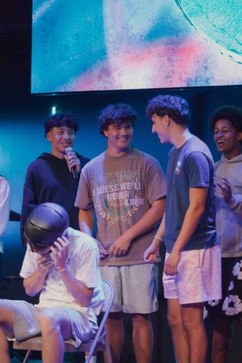 Group of diverse teenagers enjoying a church youth event at Canyon Springs Church.