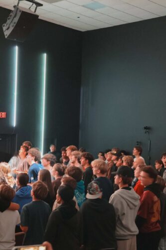 Teenagers gathered in a darkened room at Canyon Springs Church for a youth event or service. Large group of teenagers attending a youth event at Canyon Springs Church.