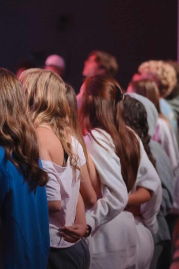 Diverse congregation of all ages attending service at Canyon Springs Church.