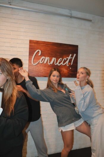 Group of teenagers socializing and having fun at Canyon Springs Church youth event.