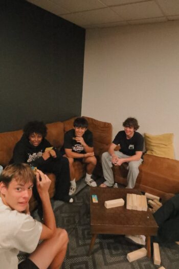 Group of teenagers hanging out in a lounge area at Canyon Springs Church.