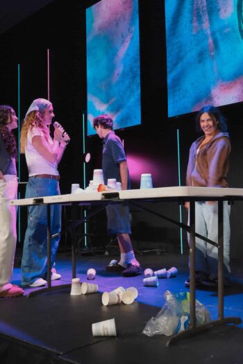 Youth group activity at Canyon Springs Church with teens playing a game on stage.