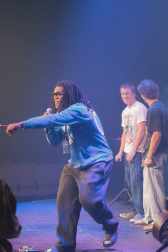 Engaged youth group members performing on stage during a church event at Canyon Springs Church. Youth group performing on stage at Canyon Springs Church event.