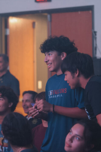 Youth group gathered at Canyon Springs Church for a community event, engaging in fellowship and spiritual activities. Group of young people enjoying a church youth event at Canyon Springs Church.