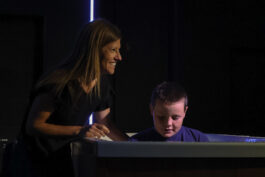 Woman and boy enjoying a musical moment together at Canyon Springs Church. Woman and boy playing piano at Canyon Springs Church event.
