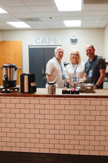 Friendly staff at Canyon Springs Church café serving coffee and snacks.